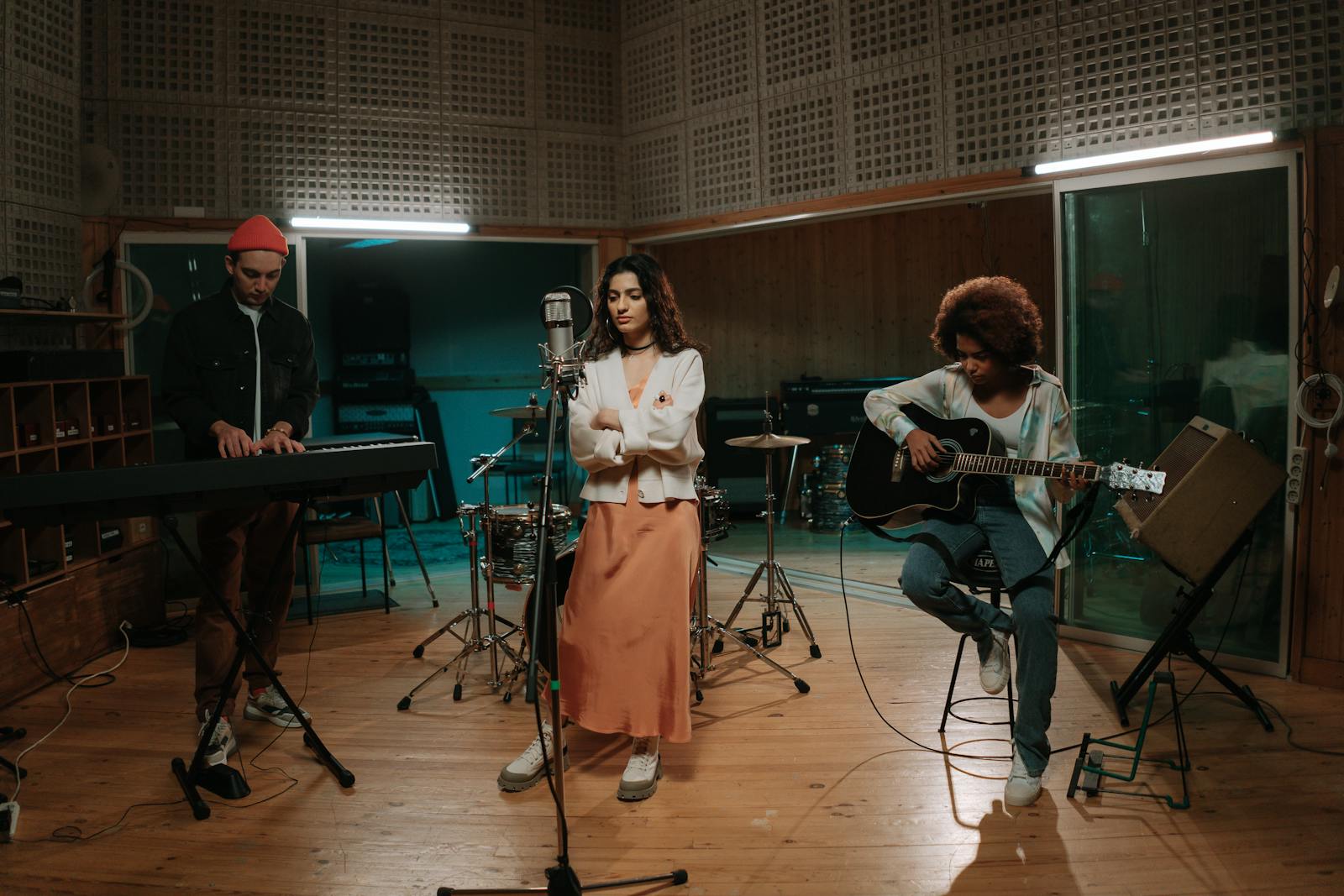Band rehearsing together in a studio session