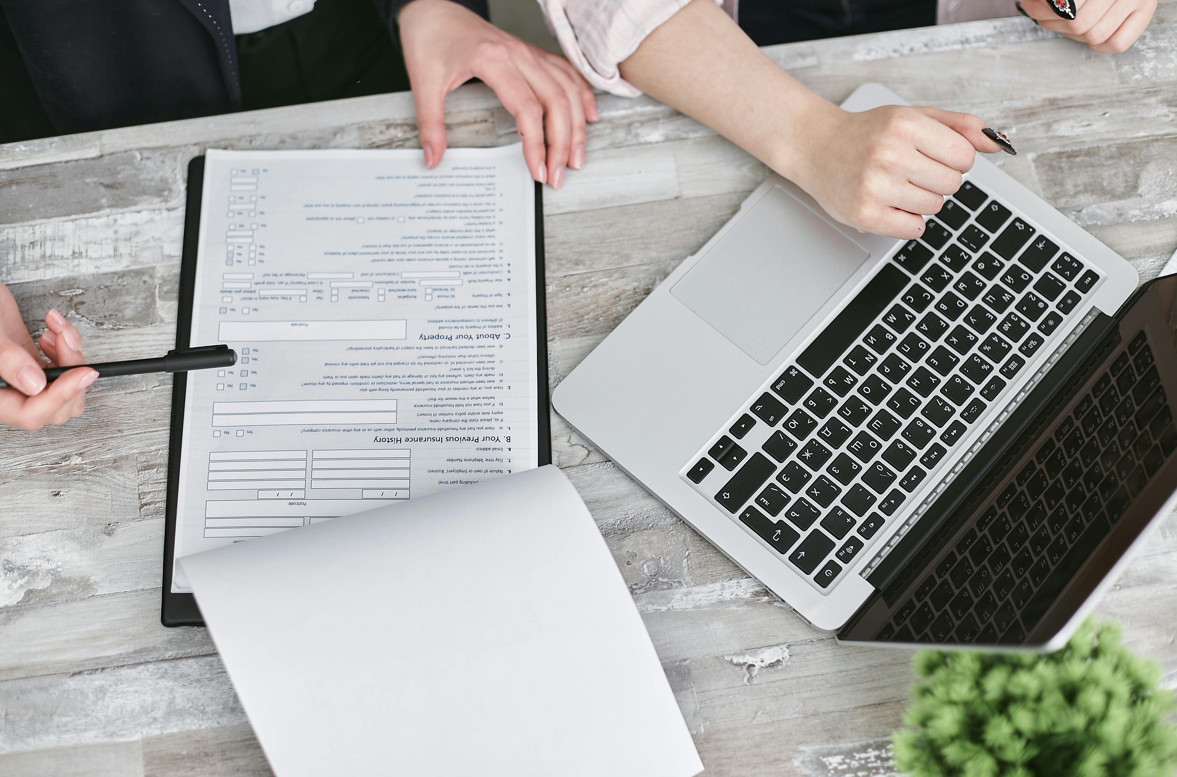 Laptop, notes, and documents used to prepare a band rehearsal
